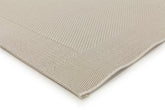 Detailed view of the Noosa Rug's Outdoor Range in Ivory, focusing on the texture and quality of the stain-resistant polypropylene material.